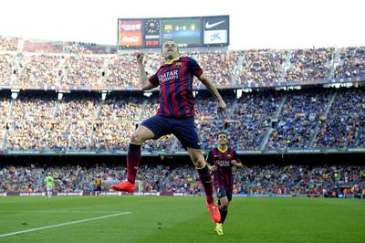 Andres Iniesta celebrates a goal during the Spanish league football match FC Barcelona vs Osasuna at Camp Nou, in Barcelona. Josep Lago / AFP / March 16, 2014.