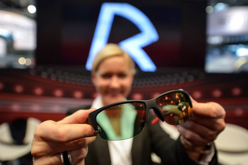 MUNICH, GERMANY - JANUARY 15: An employee shows a pair of sports glasses from Rodenstock's new ProAct line at the Rodenstock booth during the Rodenstock Sports Talk at opti 2016 tradeshow at Messe Muenchen on January 15, 2016 in Munich, Germany.  (Photo by Philipp Guelland/Getty Images)