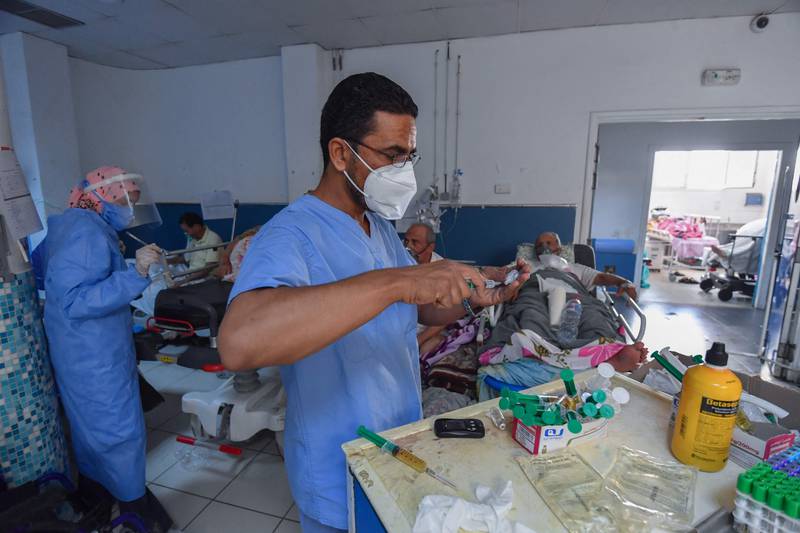 Tunisian medics provide first aid to Covid-19 patients at the Charles Nicolle Hospital in Tunis.