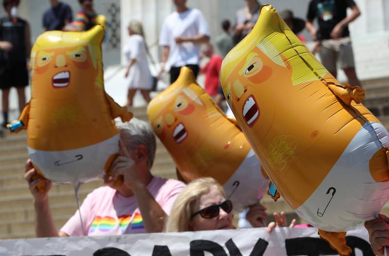 WASHINGTON, DC - JULY 03: Members of the activist group Code Pink hold Baby Trump balloons during a news conference at the Lincoln Memorial to protest against President Trump and the tanks that were brought in for the Salute to America ceremony on the Fourth of July, on July 3, 2019 in Washington, DC.   Mark Wilson/Getty Images/AFP
