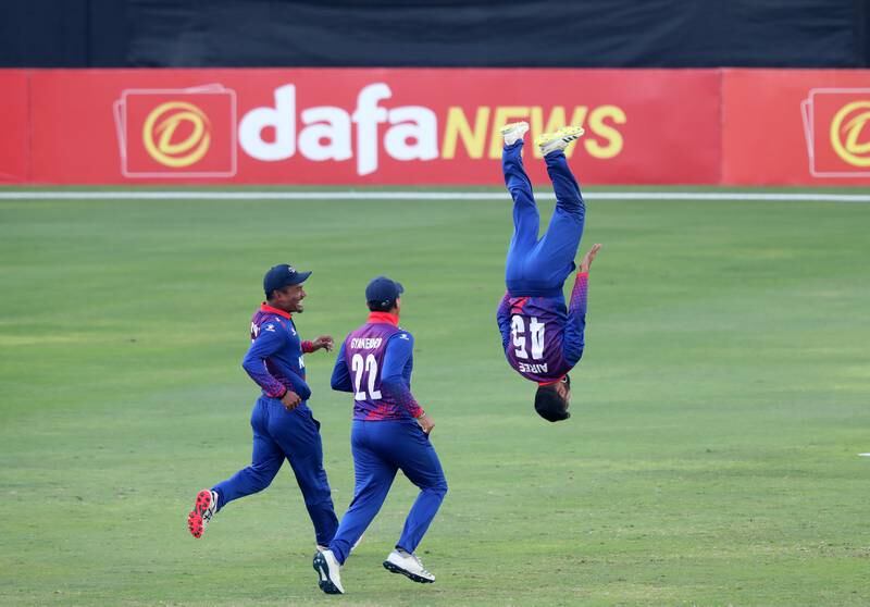 Nepal's Dipendra Singh Airee, who finished with figures of 3-18, does a back flip after dismissing the UAE's Karthik Meiyappan for a duck during the visitors' 42-run victory against the home side in the Cricket World Cup League 2 game at Dubai International Stadium on Monday, March 6, 2023. All images: Chris Whiteoak / The National