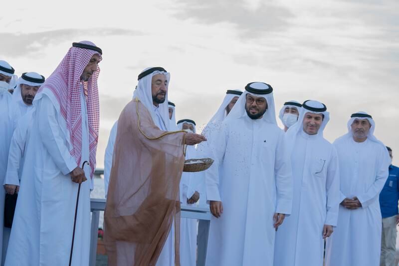 Sheikh Dr Sultan Al Qasimi, Ruler of Sharjah, scatters kernels to mark the launch