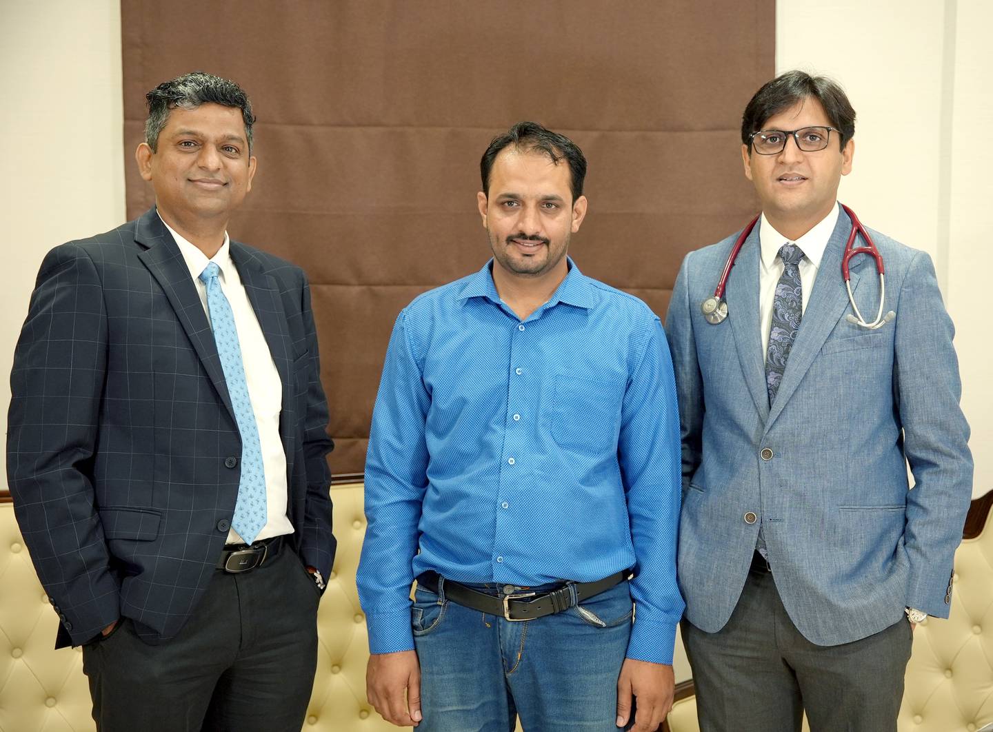 Mian Khan, centre, with Dr Vaibhav Gorde, left, and Dr Rahul Chaudhary. Photo: Burjeel Hospital