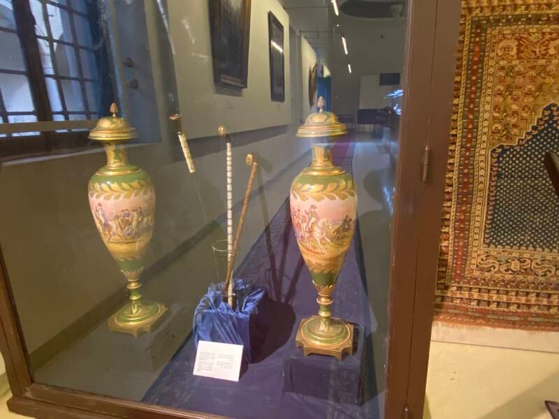 Two porcelain vases that were seized from Damietta seaport in 2018 and wooden crutches recovered from the Cairo airport in 2020. Nada El Sawy / The National