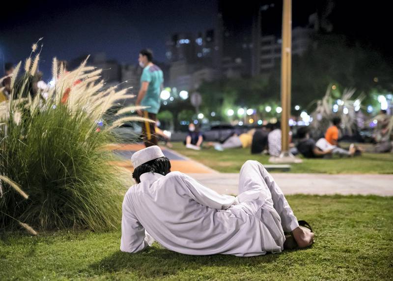 DUBAI, UNITED ARAB EMIRATES. 2 JUNE 2020. A man sits in a park by Dubai Creek in Baniyas, Deira.(Photo: Reem Mohammed/The National)Reporter:Section: