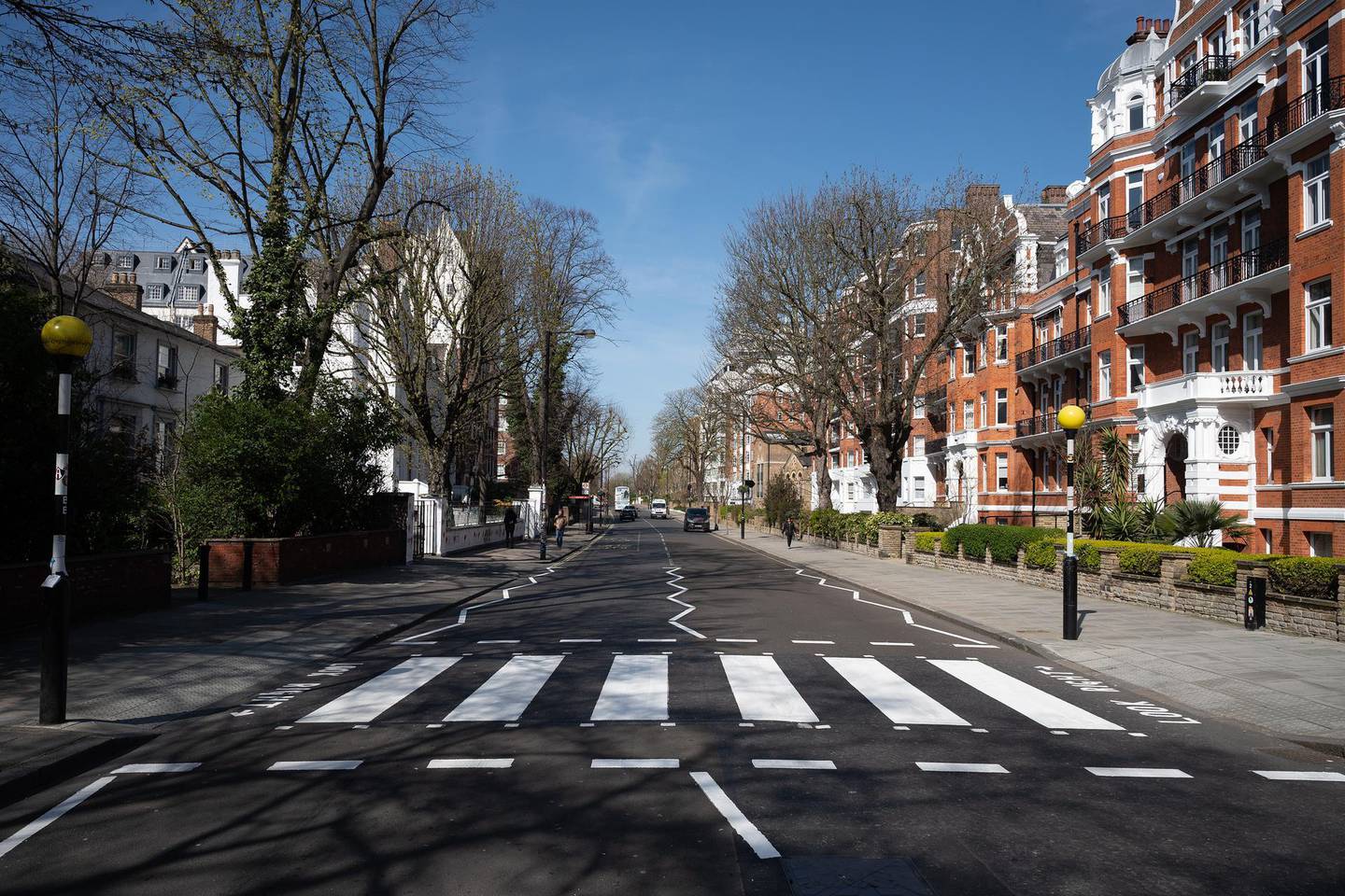 LONDON, ENGLAND - MARCH 24: The iconic Abbey Road crossing is seen after a re-paint by a Highways Maintenance team as they take advantage of the COVID-19 coronavirus lockdown and quiet streets to refresh the markings on March 24, 2020 in London, England. The Beatles made the pedestrian crossing famous after featuring a photograph of the group walking on it, near to Abbey Road Studios. The album and connected artwork celebrated its fiftieth anniversary last year. British Prime Minister, Boris Johnson, announced strict lockdown measures urging people to stay at home and only leave the house for basic food shopping, exercise once a day and essential travel to and from work. The Coronavirus (COVID-19) pandemic has spread to at least 182 countries, claiming over 10,000 lives and infecting hundreds of thousands more. (Photo by Leon Neal/Getty Images)