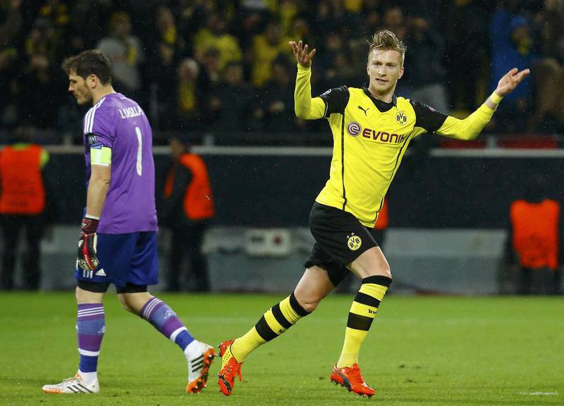 Borussia Dortmund player Marco Reus celebrates after scoring a goal against Real Madrid keeper Iker Casillas the Champions League on Tuesday night. Kai Pfaffenbach / Reuters / April 8, 2014