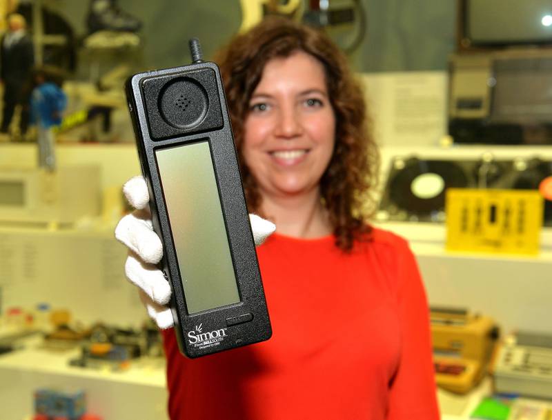 Charlotte Connelly of the Science Museum with an IBM Simon mobile phone, the first smartphone and the forerunner of today's high-tech phones. Reuters