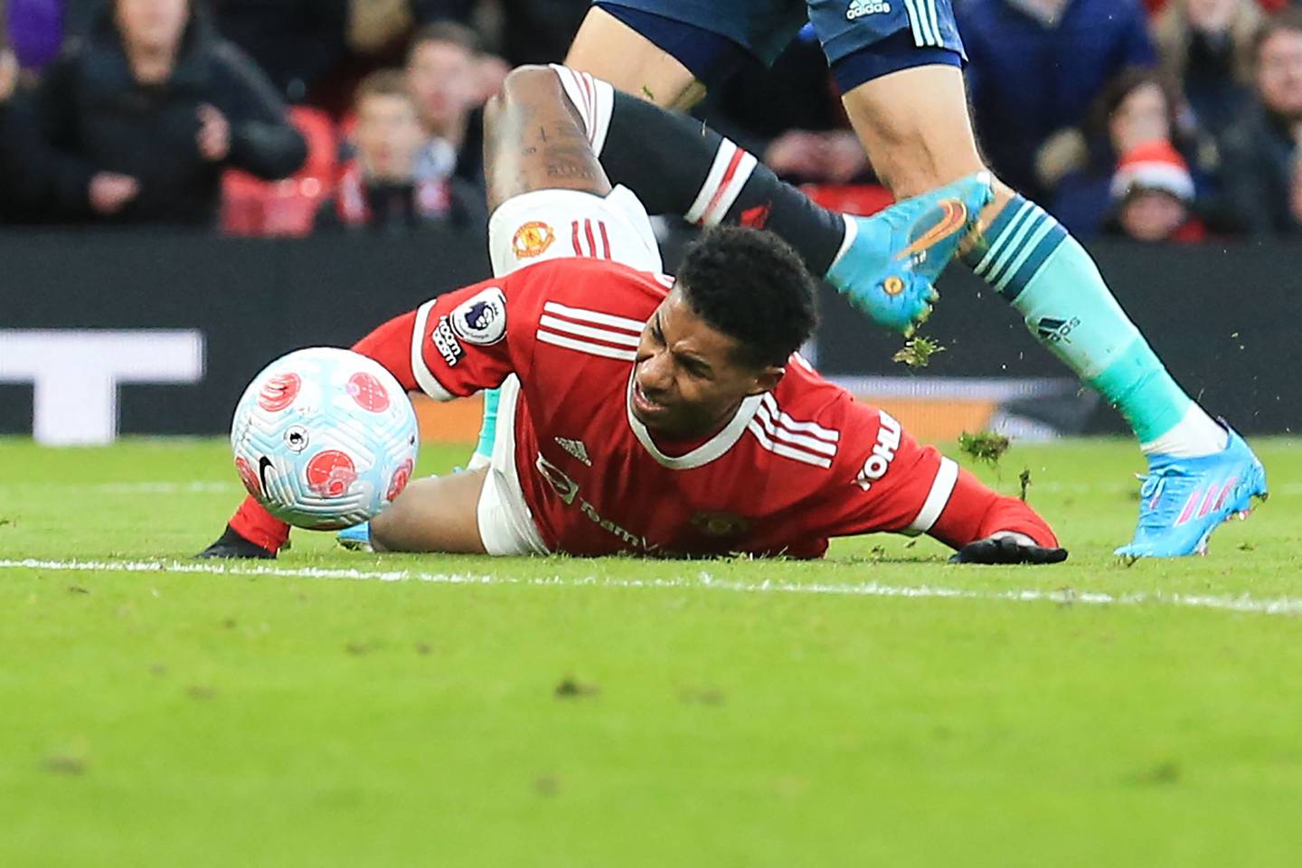 Marcus Rashford reacts after being tackled. AFP