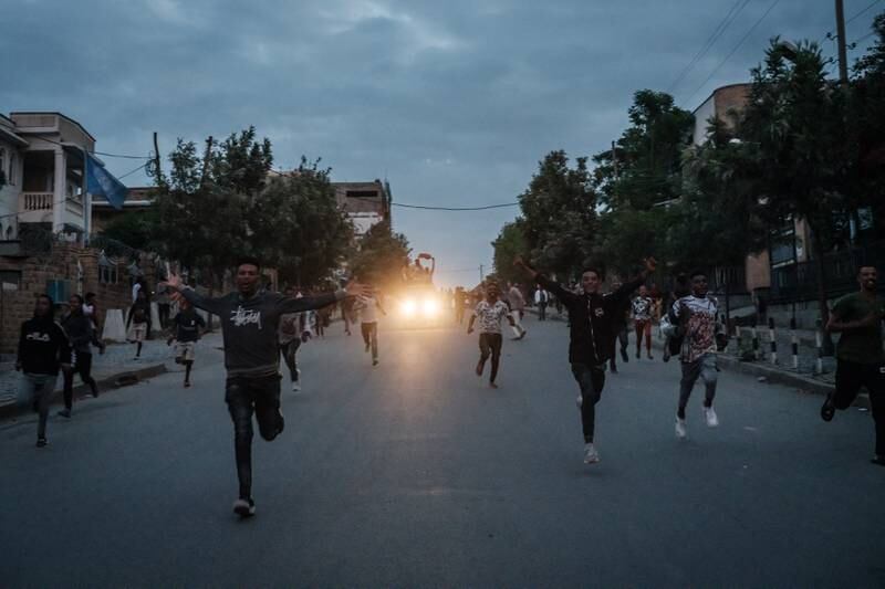 People run on a street after news of the arrival of the Tigray Defence Force in Mekelle.