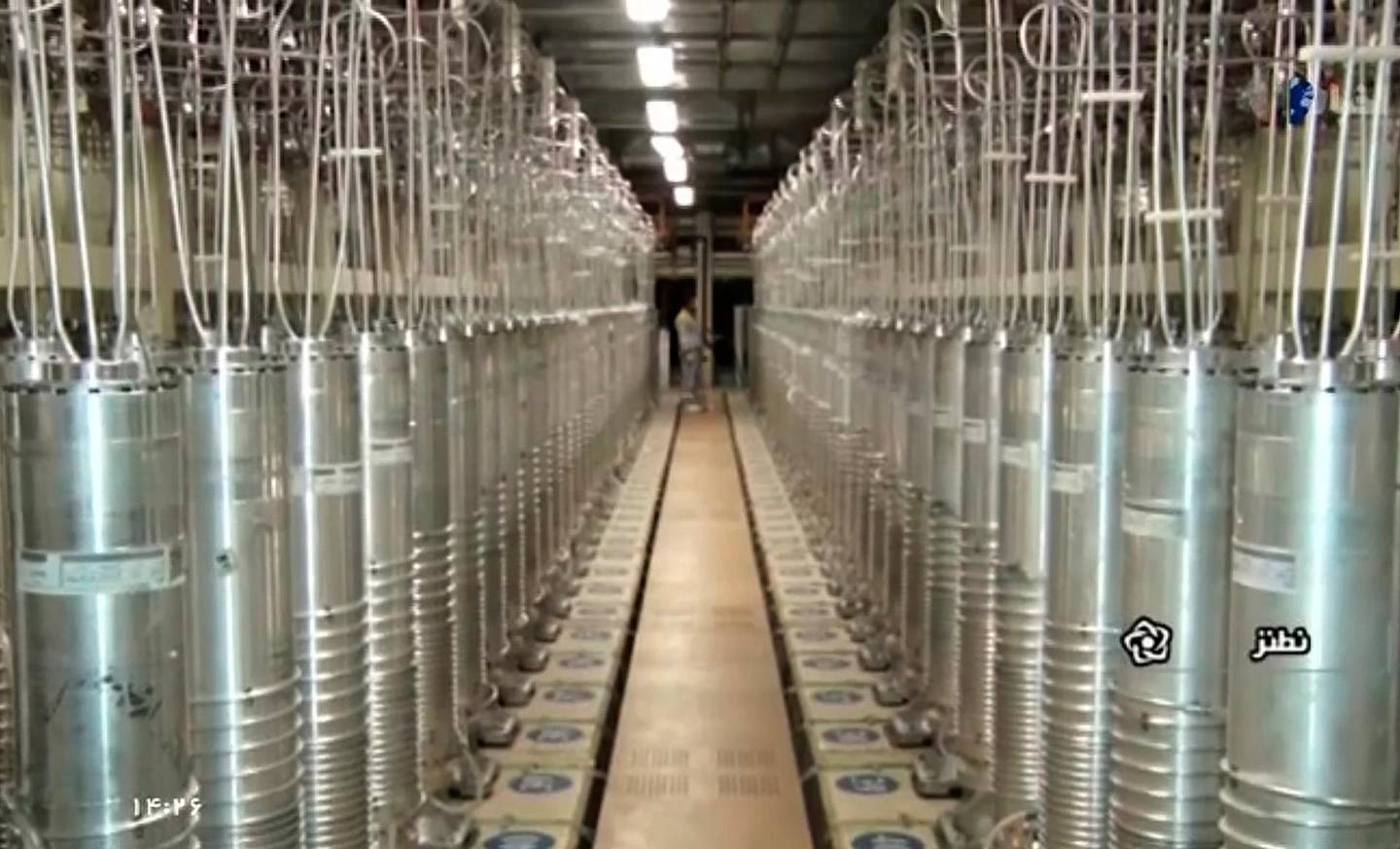 In this image made from April 17, 2021, video released by the Islamic Republic Iran Broadcasting, IRIB, state-run TV, various centrifuge machines line the hall damaged on Sunday, April 11, 2021, at the Natanz Uranium Enrichment Facility, some 200 miles (322 km) south of the capital Tehran, Iran. Iran named a suspect Saturday in the attack on its Natanz nuclear facility that damaged centrifuges there, as Reza Karimi and said he had fled the country "hours before" the sabotage happened. (IRIB via AP, File)