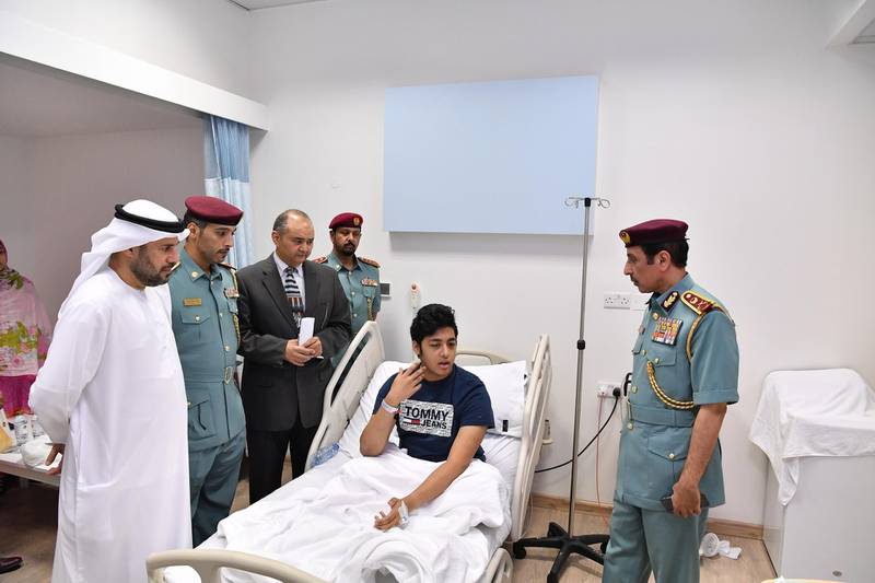Members of Ajman Police paid a visit to patients receiving treatment in hospital after a water contamination outbreak in Ajman. Courtesy Ajman Police