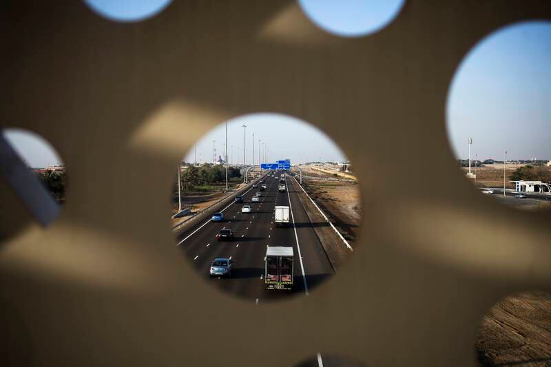 Motorists drive home along the E11 during rush-hour traffic in Abu Dhabi in April 2015. Lee Hoagland / The National