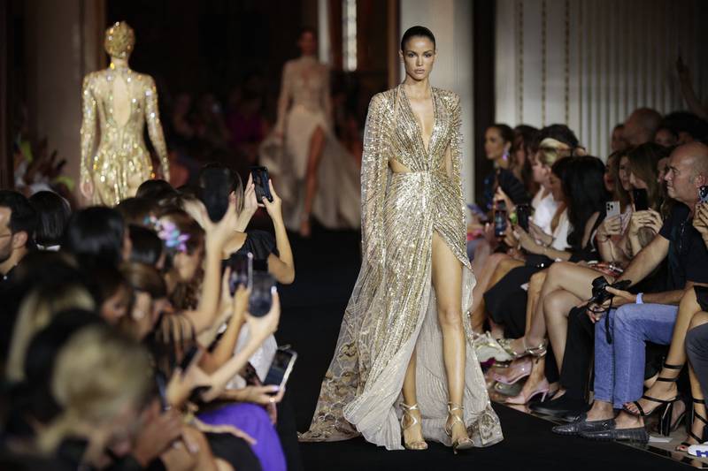 A model presents a gold creation during the Zuhair Murad women's haute couture autumn/winter 2023 fashion week in Paris. All photos: AFP