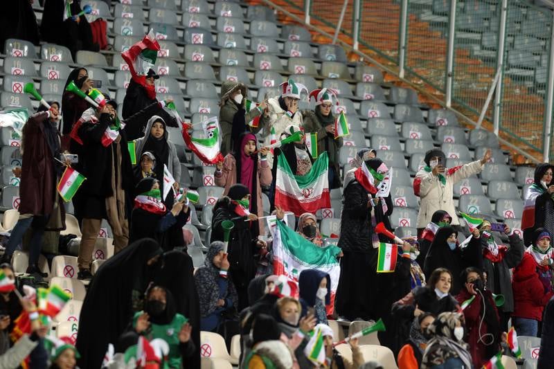 Iranian women fans cheer during the World Cup qualifier at the Azadi Stadium in Tehran. EPA