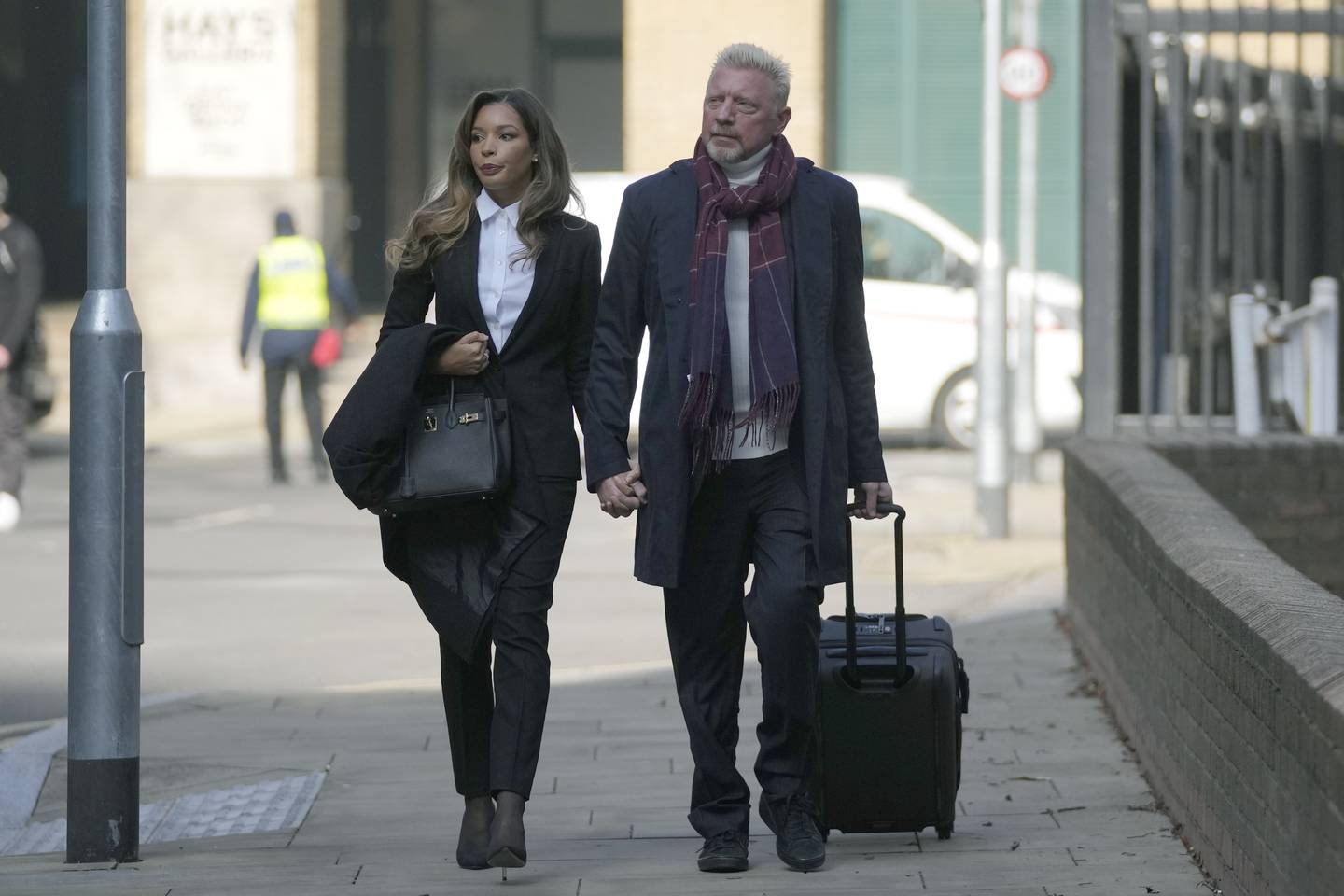 Boris Becker and Lilian de Carvalho Monteiro arriving at court in London. AP