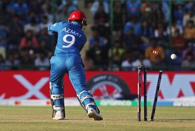 Afghanistan's Azmatullah Omarzai is bowled out by India's Hardik Pandya. Reuters
