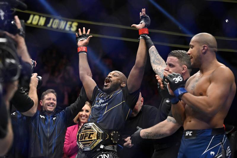 Jon Jones, center, celebrates after defeating Ciryl Gane in a UFC 285 mixed martial arts heavyweight title bout Saturday, March 4, 2023, in Las Vegas.  (AP Photo / David Becker)
