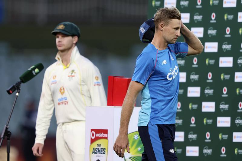 England's captain Joe Root, right, walks off as his counterpart Steve Smith takes the stage. AP