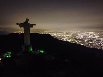 An aerial image taken by a drone shows an unlit Christ the Redeemer statue, in Rio de Janeiro, Brazil, 25 March 2023.  The famous monument had its lights shut off in support of Earth Hour 2023, organized by the World Wildlife Fund (WWF), with the goal of bringing attention to the climatic crisis.   EPA / Andre Coelho