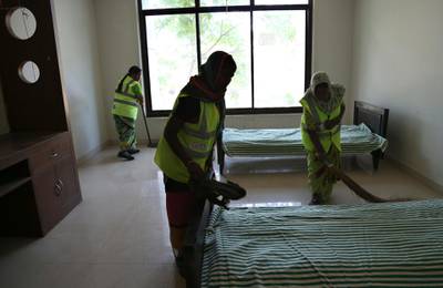 Indian municipal workers prepare a room to be used as isolation ward in Hyderabad. AP Photo