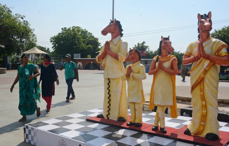 Pedestrians walk past the mascot, Thambi, near Marina Beach on the first day of the 44th Chess Olympiad in Chennai, India. AP Photo