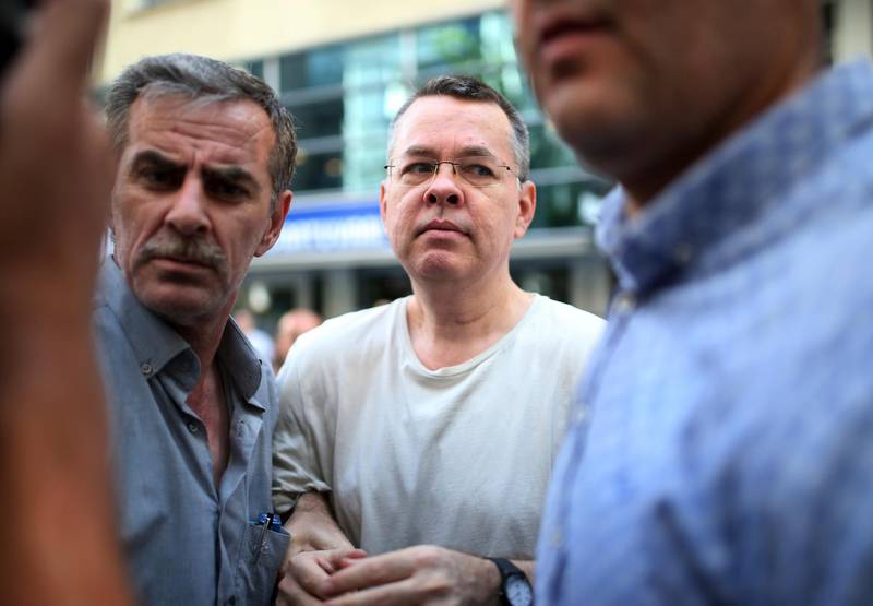 In this July 25, 2018 photo, Andrew Craig Brunson, an evangelical pastor from Black Mountain, North Carolina, arrives at his house in Izmir, Turkey.   Brunson, who had been jailed in Turkey for more than one and a half years on terror and espionage charges was released and will be put under house arrest as his trial continues.  The White House is announcing that the Treasury Department is imposing sanctions on two Turkish officials over a detained American pastor who is being tried on espionage and terror-related charges.  (AP Photo/Emre Tazegul)