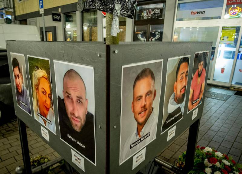 Pictures of the victims of the Hanau shooting are placed in front of a Shisha bar at Heumarkt in Hanau. AP Photo