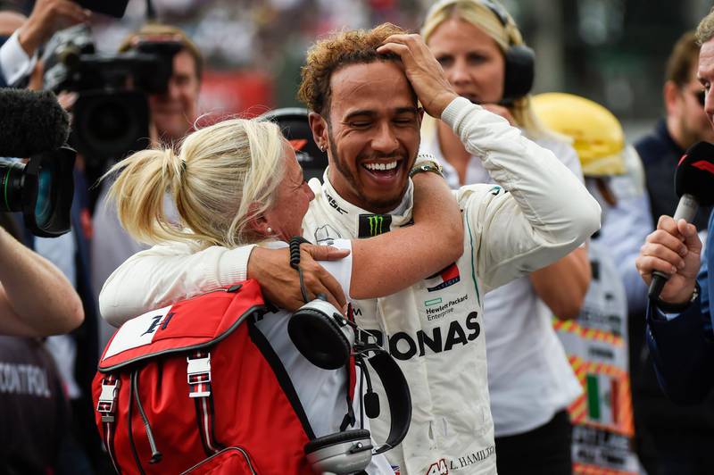 Lewis Hamilton is embraced by team physiotherapist Angela Cullen after winning his fifth world title. AP Photo