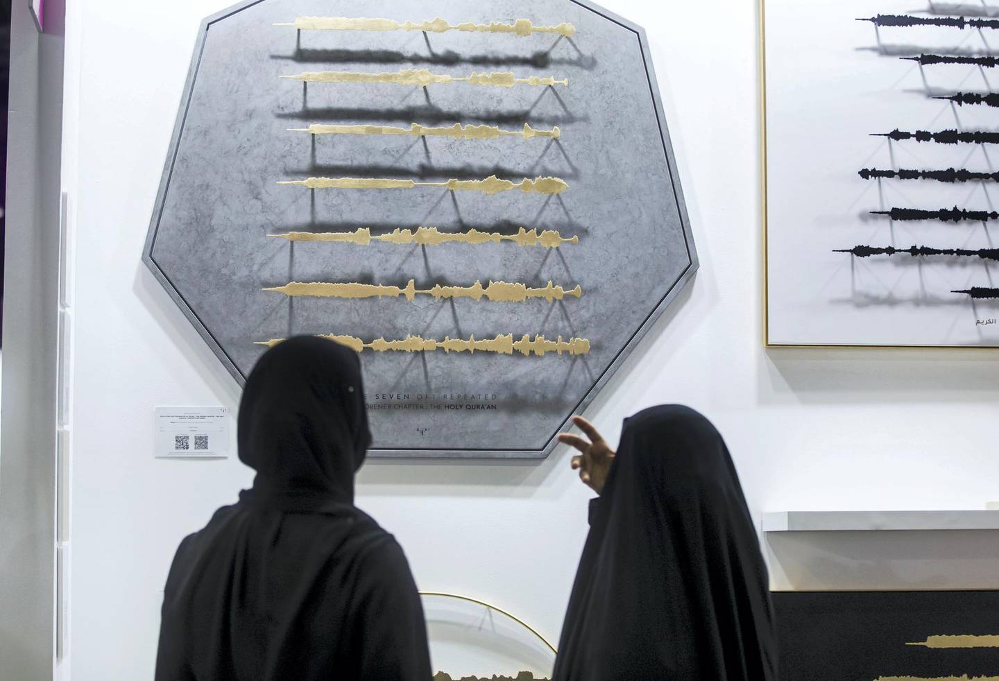 Dubai, United Arab Emirates - Visitors  looking at the artwork of artist Sara Alharbali called Tajrid at the World Art Dubai at Dubai World Trade Centre.  Leslie Pableo for The National for Razmig's story