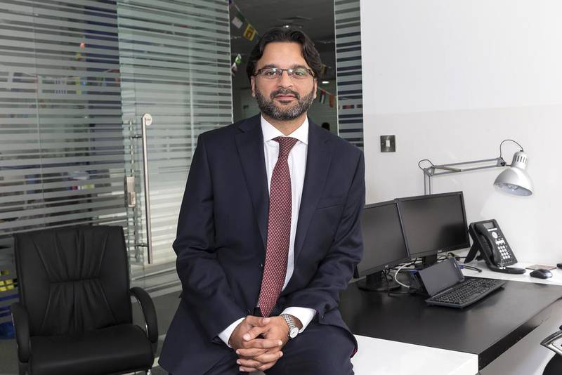 Murtaza Khan, a partner in immigration service provider Fragomen Worldwide, pictured at the company office in Dubai Internet City. Antonie Robertson / The National