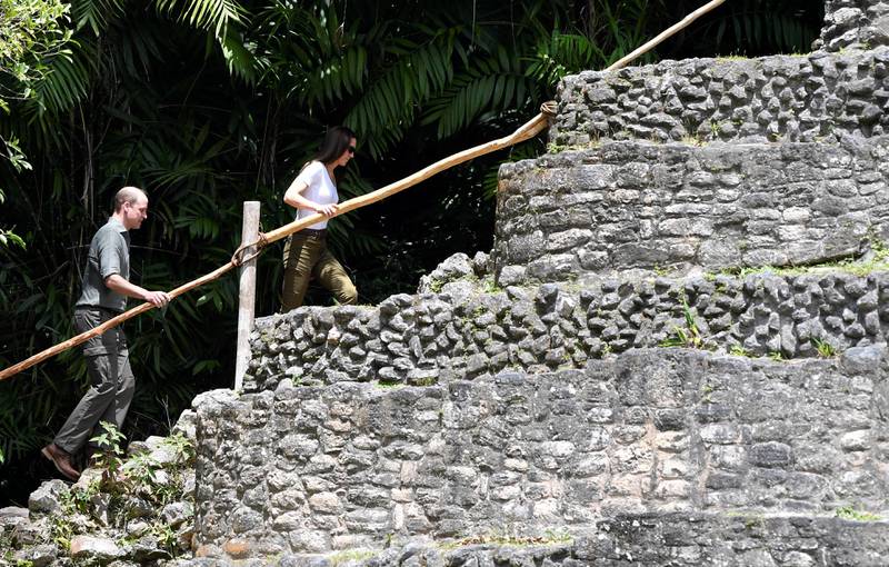 The couple were casually dressed as they climbed the steep steps of the pyramid-like structure called Caana. Reuters