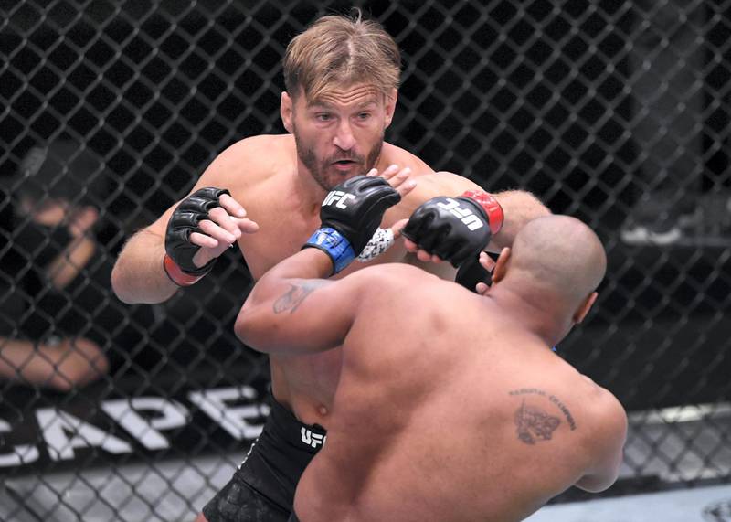 LAS VEGAS, NEVADA - AUGUST 15: (L-R) Stipe Miocic punches Daniel Cormier in their UFC heavyweight championship bout during the UFC 252 event at UFC APEX on August 15, 2020 in Las Vegas, Nevada. (Photo by Chris Unger/Zuffa LLC)