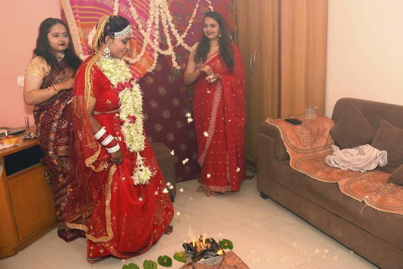 Kshama Bindu performs rituals during her solo wedding ceremony at her home in Vadodara as friends look on. AP