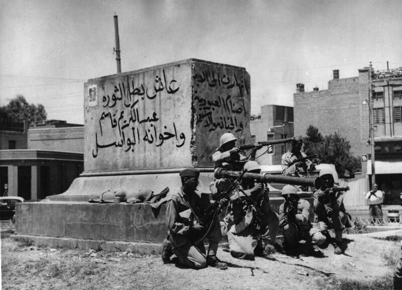 Heavily armed revolutionary soldiers on a street of Baghdad, on July 14, 1958, a few hours after the military staged a coup to take control of the country and overthrow the monarchy, declaring a republic. King Faisal II and Crown Prince Abdullah were shot dead in his palace at the height of the coup. AP
