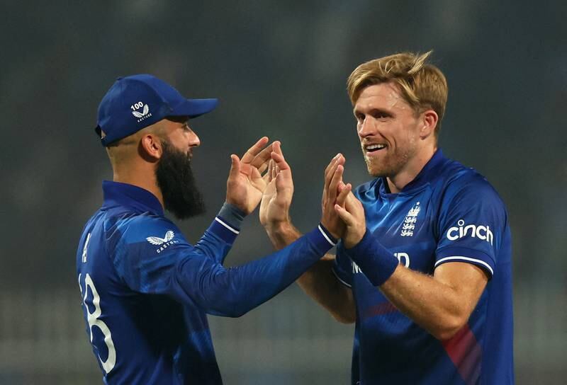 England's David Willey celebrates with Moeen Ali after taking the wicket of Pakistan's Fakhar Zaman. Reuters