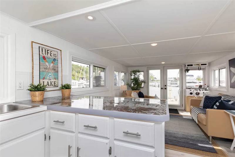 All rooms overlook the water on this Canadian houseboat. Photo: Zillow