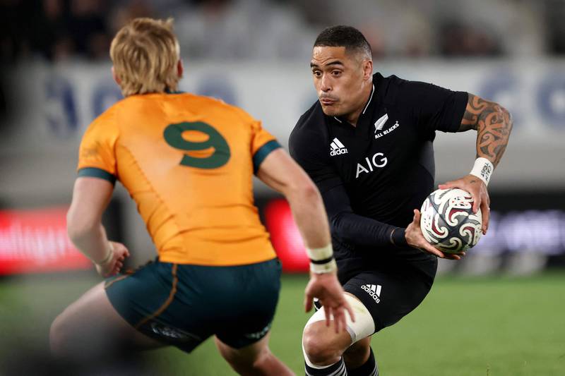 Aaron Smith of New Zealand tries to avoid a tackle during the second Bledisloe Cup match against Australia at Eden Park in Auckland on August 14, 2021. AFP
