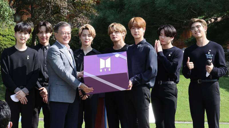 BTS present a purple gift box to President Moon Jae-in during the inaugural Youth Day event in Seoul on September 19, 2020. EPA