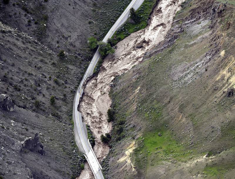 The motorway between Gardiner and Mammoth in Montana is washed out, trapping tourists, as historic flooding damages roads and bridges and floods homes along area rivers. The Billings Gazette / AP