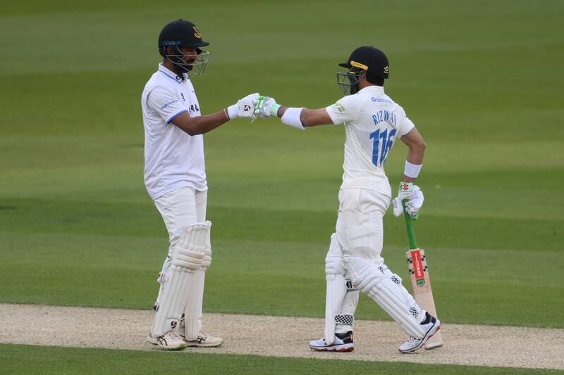 HOVE, ENGLAND - APRIL 29: Cheteshwar Pujara (L) and Mohammad Rizwan of Sussex fist pump during the LV= Insurance County Championship match between Sussex and Durham at The 1st Central County Ground on April 29, 2022 in Hove, England. (Photo by Mike Hewitt / Getty Images)