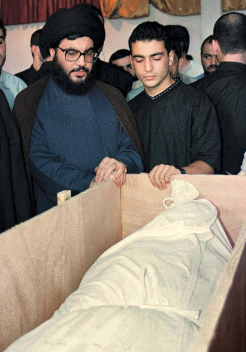 PRO-IRANIAN HIZBOLLAH LEADER SHEIKH HASSAN NASRALLAH STANDS WITH HIS SON JAWAD TO VIEW HIS ELDEST SON HADI' S BODY.


MIDEAST-SWAP:BEIRUT,26JUN98-Pro-Iranian Hizbollah leader Sheikh Hassan Nasrallah (L) and his son Jawad (R) view the body of his eldest son Hadi June 26, who was killed in fighting with Israeli forces last year in south Lebanon. Nasrallah visited a school in the southern suburbs of Beirut to view the bodies of Hiizbollah guerrillas returned by Israel the previous day. - RP1DRIGCBFAD