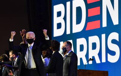 US president-elect Joe Biden gestures in celebration after delivering remarks in Wilmington, Delaware. AFP