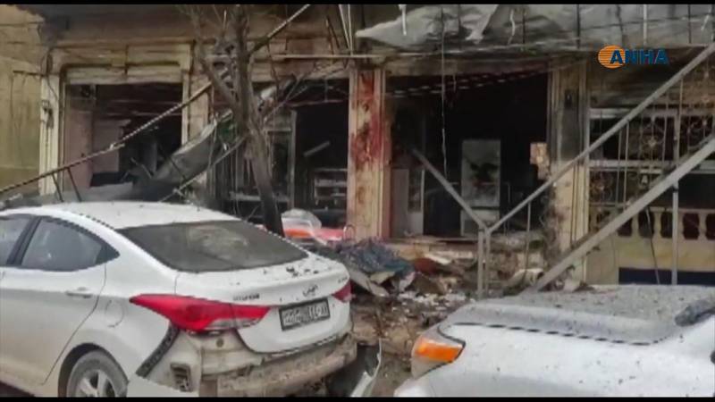 An image grab taken from a video published by Hawar News Agency (ANHA) on January 16, 2019, shows the aftermath of a suicide attack in the northern Syrian town of Manbij. 


 A suicide attack targeting US-led coalition forces in the flashpoint northern Syrian city of Manbij killed a US serviceman and 14 other people today, a monitor said.
 / AFP / ANHA / -
