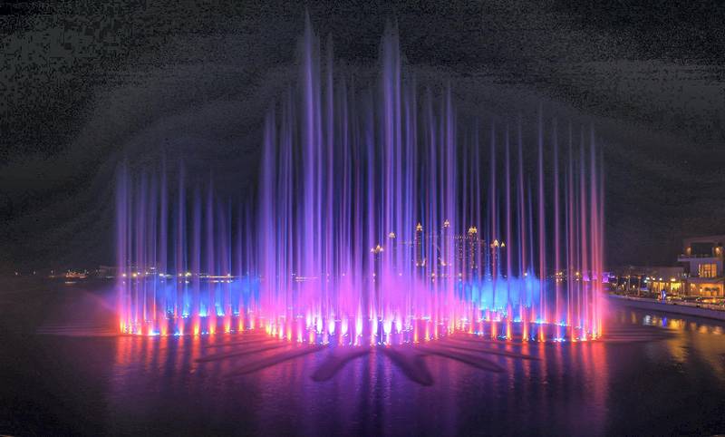 The Palm Fountain in Dubai is dotted with a number of restaurants with views of the water, light and sound show.