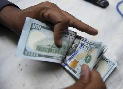 The US dollar enjoyed a mini renaissance in the first half of the month. Asif Hassan / AFP