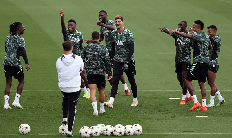 Real Madrid's players, including goalkeeper Thibaut Courtois, centre, during training. AFP