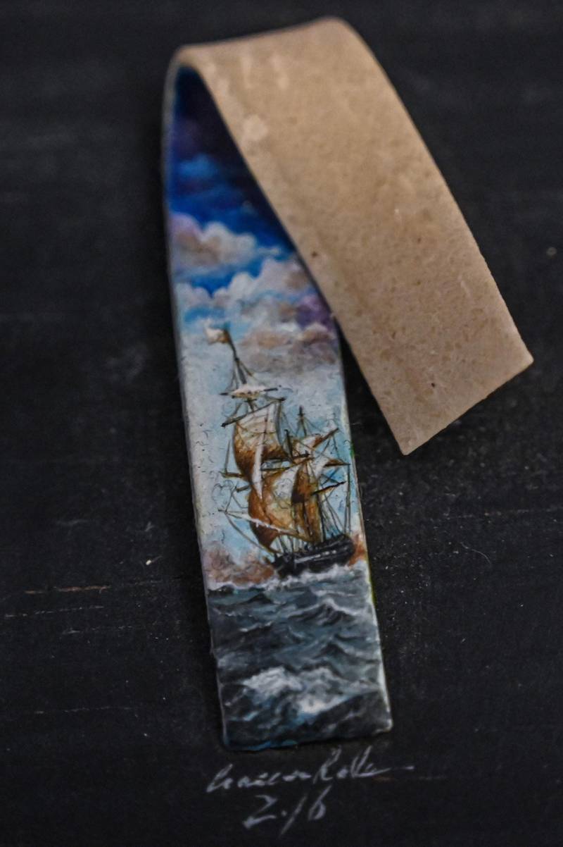 A painting on a piece of gum by Turkey's micro artist Hasan Kale