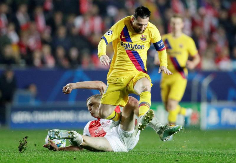 Lionel Messi is challenged by SK Slavia Prague's Tomas Soucek. Reuters