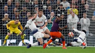 Tottenham's Danny Rose, right, flings himself at a Raheem Sterling shot before the incident is reviewed by VAR. Reuters